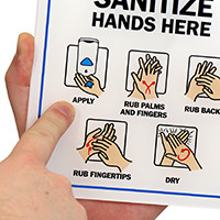 Sanitizing station for showcase - hands here sign